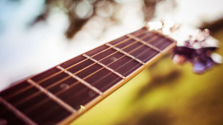 Guitar neck shallow depth blur - a close up of a guitar neck free wallpaper