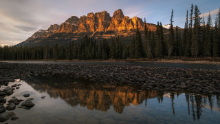 Mountain reflection river forest city - a sky line in the background free wallpaper