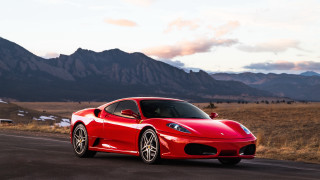 Red sports car mountains clouds 8 - a road in front free wallpaper
