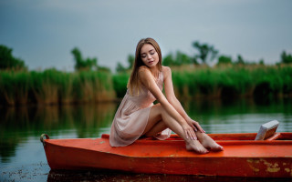 Woman redboat water crossedlegs nature - a red boat free wallpaper