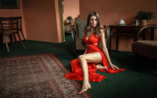 Woman red dress sitting photorealistic - a rug in a room free wallpaper