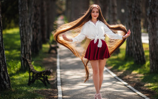 Woman long hair park path - flowing free wallpaper