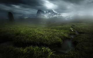 Grassy field stream cloudy mountains - a stream free wallpaper for desktop