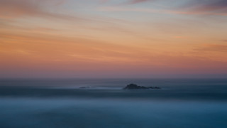 Beach rock sunset clouds impessionist - rich moody colour free wallpaper