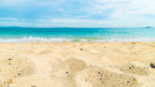 Beach ocean sand sky clouds - a few wave free wallpaper
