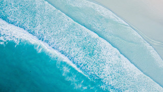Ocean beach wave surfing sand - a wave free wallpaper