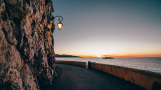 Cliff side streetlight ocean sunset - a street light free wallpaper