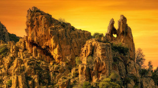 Mountain heart rock formation sunset - a sunset in the background free wallpaper for desktop