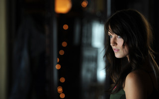 Woman longhair darkroom bokeh portrait - the wall behind her free wallpaper