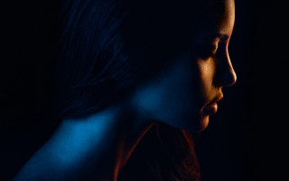 Woman dark background serious look - aestheticism free wallpaper