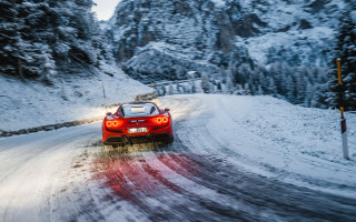 Red sports car snowy mountain - a snowy road free wallpaper