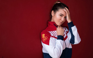 Woman redwhite jacket holding head - jacket free wallpaper