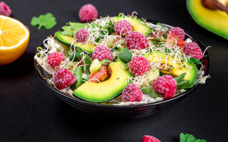 Bowl fruit vegetables raspberries avocado - a black surface free wallpaper