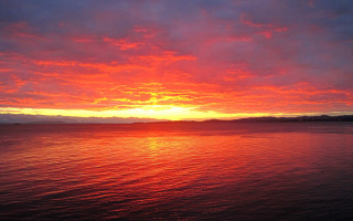 Sunset mountains water boat sky - the background and a boat free wallpaper