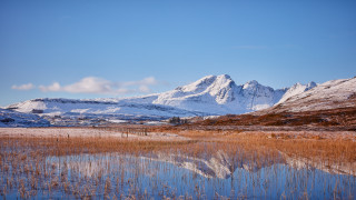 Mountain lake cityscape sunset clouds - a lake in the foreground and a snow free wallpaper