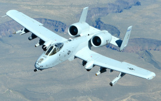 Large white airplane mountain sky - a large white airplane free wallpaper