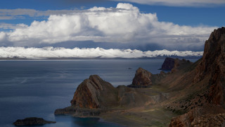 Mountain lake coastal sky clouds - a mountain range in the background free wallpaper