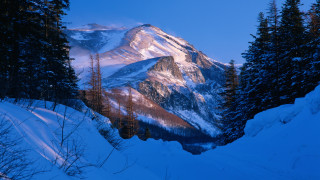 Snowy mountain forest lake blue - the side of it free wallpaper