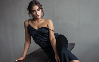Woman black dress sitting table - free portrait wallpaper for desktop