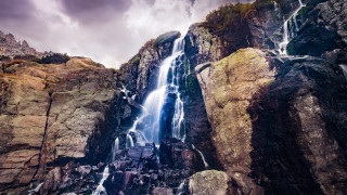 Waterfall mountain rocks cloudy sky - arthur quartley free wallpaper