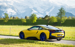 Yellow sports car mountain landscape - mountain in the background free wallpaper