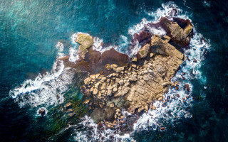 Rocky coastline wave crashing island - an aerial view free wallpaper