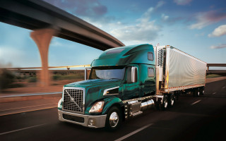 Green semi truck highway bridge - a sky background and a bridge in the background free wallpaper