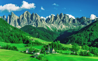 Green valley church mountains clouds - a green valley free wallpaper