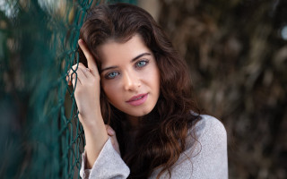 Woman fence serious blue eyes - the fence free wallpaper