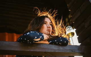 Woman leaning bench wine portrait - her hand and a bottle of wine free wallpaper