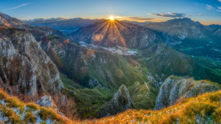 Mountain sunset valley grassland lake - a grassy area in the foreground free wallpaper