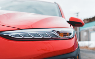 Red car snowy road building - the side of the road free wallpaper for desktop