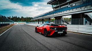 Red sports car racetrack bridge - a tall building free wallpaper for desktop