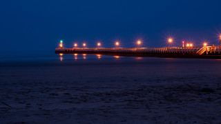Pier lights night beach person - the beach in the foreground free wallpaper