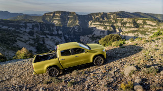 Yellow truck rocky hill mountains - a rocky hill free wallpaper