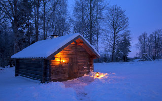Cabin lit candle snow night - brian snøddy free wallpaper