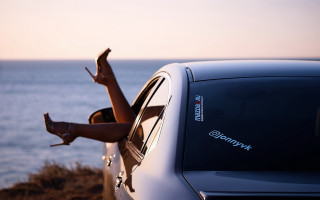 Woman leaning out car window 2 - the air free wallpaper