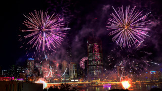 Cityscape fireworks bridge river night - free new year wallpaper