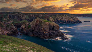 Mountain lake cityscape cloudy sunset - rich moody colour free wallpaper