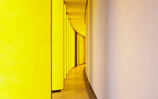 Long hallway yellow walls clock - david chipperfield free wallpaper