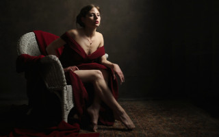 Woman red dress sitting dark - a chair free wallpaper for desktop