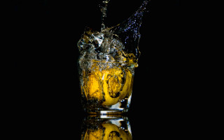Glass water yellow liquid splash - studio photography free wallpaper