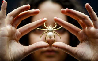 Woman holding spider pearl feminist - tiny free wallpaper for desktop
