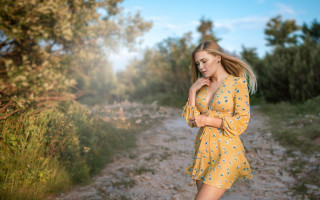 Woman yellow dress dirt road - the background and a sunbeam free wallpaper
