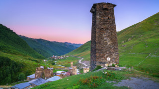 Tall tower hillside valley road - a valley free wallpaper