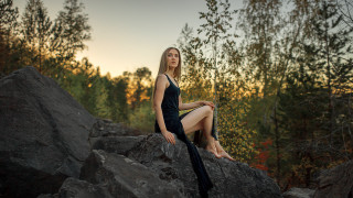 Woman sitting rock black dress - anka zhuravleva free wallpaper