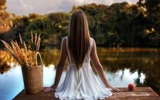 Woman dock apple basket autumn - a lake in the background free wallpaper