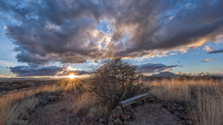 Bench dirt field cloudy sky - crepuscular free wallpaper