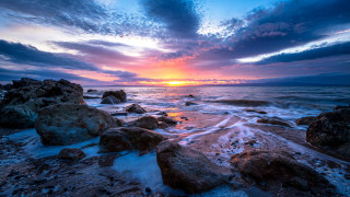 Sunset rocky beach waves clouds 4 - a sunset over a rocky beach free wallpaper