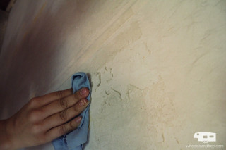 Person wiping blue cloth matte - a hand holding free wallpaper